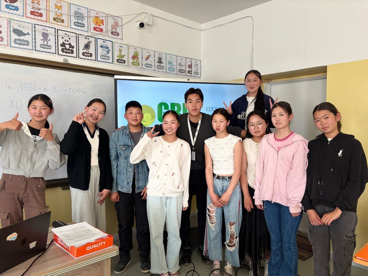 A teacher with GRIT EDU students in class